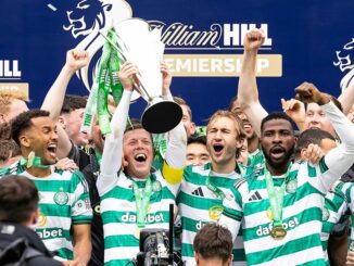 The Celtic FC players lift the Scottish Premiership trophy after being crowned champions for season 2025/26 with a 3-1 victory over Hearts.