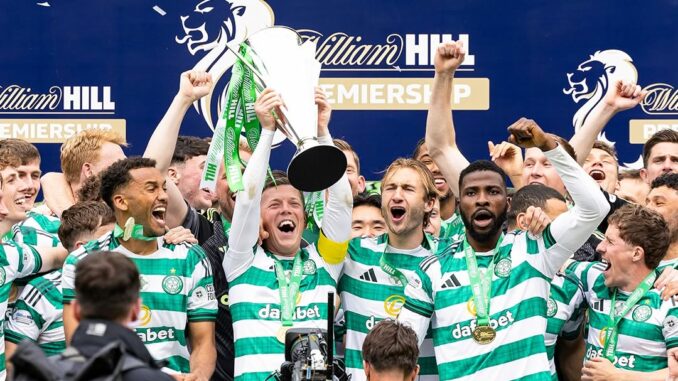The Celtic FC players lift the Scottish Premiership trophy after being crowned champions for season 2025/26 with a 3-1 victory over Hearts.