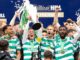 The Celtic FC players lift the Scottish Premiership trophy after being crowned champions for season 2025/26 with a 3-1 victory over Hearts.
